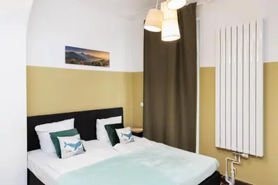 Ein Bett oder Betten in einem Zimmer der Unterkunft Urban Stay Berlin Wilmersdorf