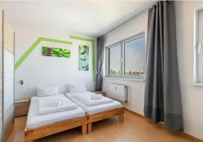 Ein Bett oder Betten in einem Zimmer der Unterkunft Berlin Central Premium Apartments for Groups