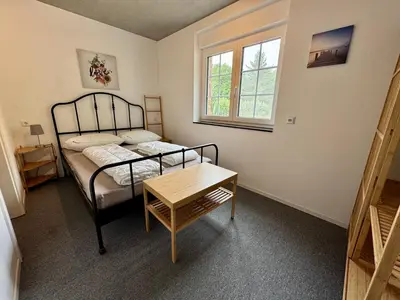 Ein Bett oder Betten in einem Zimmer der Unterkunft FeWo Akazie 1 am Scharmützelsee