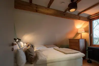 Ein Bett oder Betten in einem Zimmer der Unterkunft Design farmhouse in the countryside
