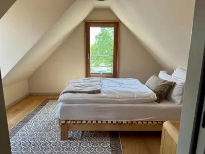 Ein Bett oder Betten in einem Zimmer der Unterkunft Design farmhouse in the countryside
