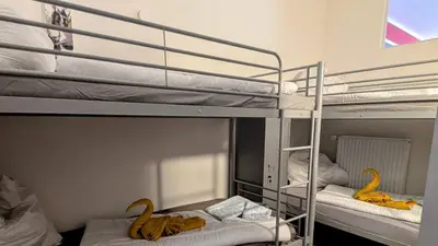 Ein Bett oder Betten in einem Zimmer der Unterkunft Rhin Quartier Ferienwohnung Hostel-Style