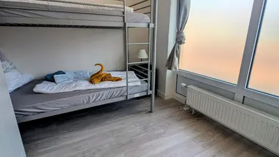 Ein Bett oder Betten in einem Zimmer der Unterkunft Rhin Quartier Ferienwohnung Hostel-Style