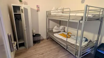 Ein Bett oder Betten in einem Zimmer der Unterkunft Rhin Quartier Ferienwohnung Hostel-Style