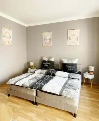 Ein Bett oder Betten in einem Zimmer der Unterkunft Stadtherz
