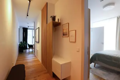 Ein Bett oder Betten in einem Zimmer der Unterkunft Stay Cozy - Apartment am See mit Pool und Sauna