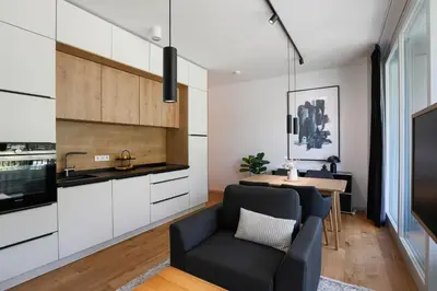 Küche/Küchenzeile in der Unterkunft Stay Cozy - Apartment am See mit Pool und Sauna