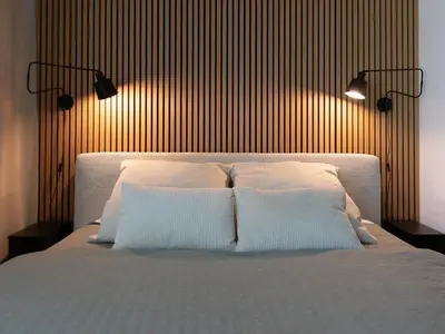 Ein Bett oder Betten in einem Zimmer der Unterkunft Stay Cozy - Apartment am See mit Pool und Sauna