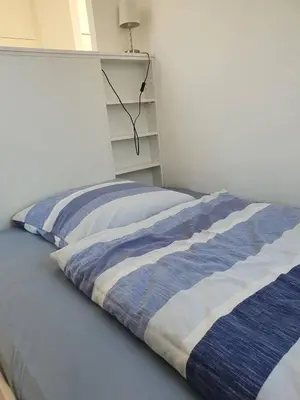 Ein Bett oder Betten in einem Zimmer der Unterkunft SunWest - Apartment in Kleinmachnow