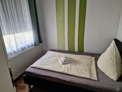 Ein Bett oder Betten in einem Zimmer der Unterkunft Pension im Gesundbrunnental Bad Freienwalde