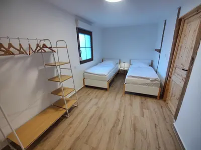 Ein Bett oder Betten in einem Zimmer der Unterkunft Wustermark Ferienwohnung Unterkunft Dorfanger 8
