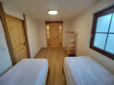 Ein Bett oder Betten in einem Zimmer der Unterkunft Wustermark Ferienwohnung Unterkunft Dorfanger 8