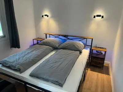 Ein Bett oder Betten in einem Zimmer der Unterkunft Feriendorf Seddiner See - Bungalow 7