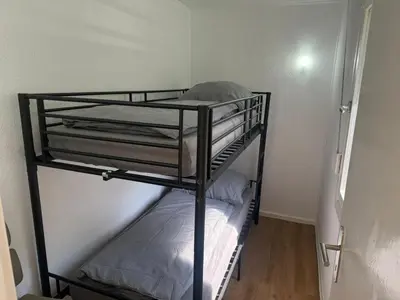 Ein Bett oder Betten in einem Zimmer der Unterkunft Feriendorf Seddiner See - Bungalow 7