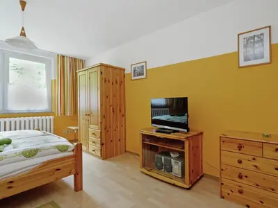 Ein Bett oder Betten in einem Zimmer der Unterkunft Elite-Ferienhaus mit Garten in Spreenhage