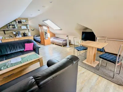 Ein Sitzbereich in der Unterkunft Ferienwohnung Am Fenn