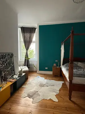 Ein Bett oder Betten in einem Zimmer der Unterkunft Altbau Prenzlauer Berg - 3 Zimmer - 2 Schlafzimmer