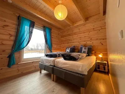 Ein Bett oder Betten in einem Zimmer der Unterkunft Ferienhaus 4 Elemente in Selchow mit tollem Garten