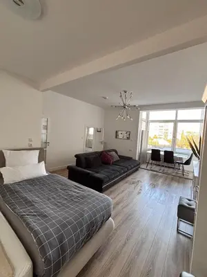 Ein Bett oder Betten in einem Zimmer der Unterkunft Großes, helles 1-ZimmerApartment bis zu 3 Personen