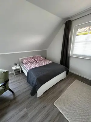 Ein Bett oder Betten in einem Zimmer der Unterkunft FeWo-Johannisthal