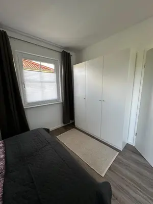 Ein Bett oder Betten in einem Zimmer der Unterkunft FeWo-Johannisthal