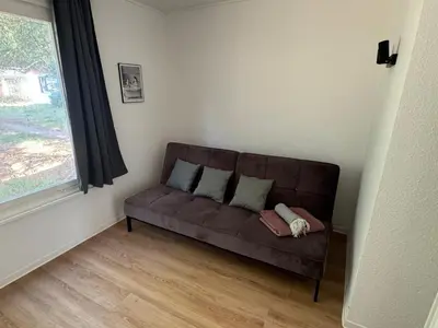 Ein Sitzbereich in der Unterkunft Feriendorf Seddiner See - Bungalow 3