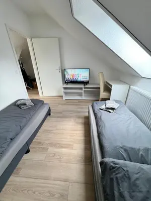 Ein Bett oder Betten in einem Zimmer der Unterkunft Oranienburg Unterkunft max 7P mit 4 Schlafzimmern