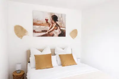 Ein Bett oder Betten in einem Zimmer der Unterkunft Apartment mit Seeblick Ruppinersee