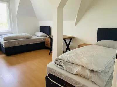 Ein Bett oder Betten in einem Zimmer der Unterkunft 2 Bett Zimmer in Villa im Grunewald