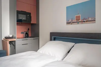 Ein Bett oder Betten in einem Zimmer der Unterkunft Homaris Nolli Studios