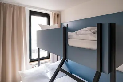 Ein Bett oder Betten in einem Zimmer der Unterkunft Homaris Nolli Studios