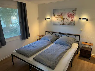 Ein Bett oder Betten in einem Zimmer der Unterkunft Feriendorf Seddiner See - Bungalow 1
