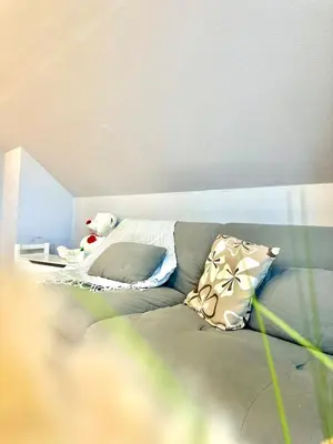 Ein Sitzbereich in der Unterkunft Ferienwohnung Prieros am Langer See mit Klima