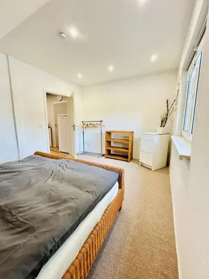 Ein Bett oder Betten in einem Zimmer der Unterkunft Ferienwohnung Prieros am Langer See mit Klima