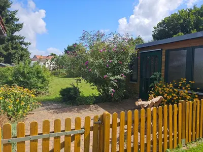 Ein Garten an der Unterkunft Gemütliche Wohnung mit Garten