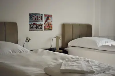 Ein Bett oder Betten in einem Zimmer der Unterkunft Autohof Apartments - Concept Stay