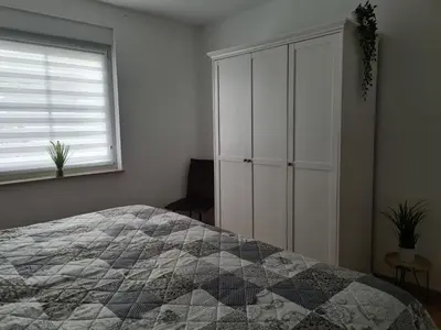 Ein Bett oder Betten in einem Zimmer der Unterkunft Ferienwohnung inmitten von Seen