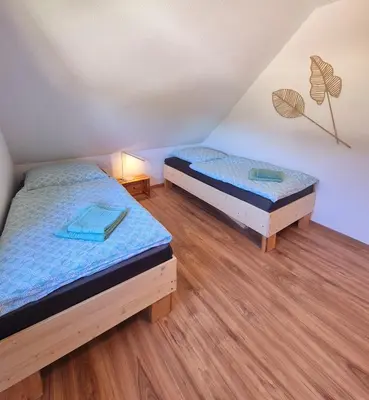 Ein Bett oder Betten in einem Zimmer der Unterkunft Ferienwohnung Sunny 2