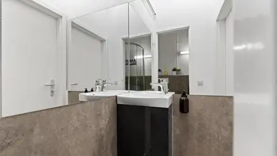 Ein Badezimmer in der Unterkunft Design Suite - Sauna & zentral - 75 QM