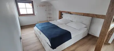 Ein Bett oder Betten in einem Zimmer der Unterkunft Wustermark Ferienwohnung Dorfanger 8