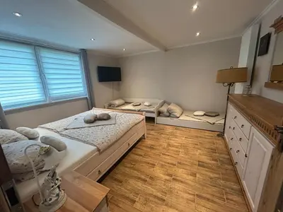 Ein Bett oder Betten in einem Zimmer der Unterkunft Ferienhäuser Uckermark Ponderosa