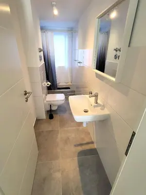Ein Badezimmer in der Unterkunft Apartment 1Zi Villa Asih