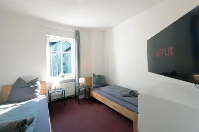 Ein Bett oder Betten in einem Zimmer der Unterkunft Urbanes Dachrefugium mit Balkon