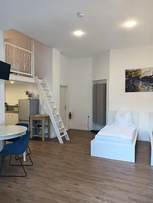 Ein Bett oder Betten in einem Zimmer der Unterkunft AF Apartments Studio Berlin