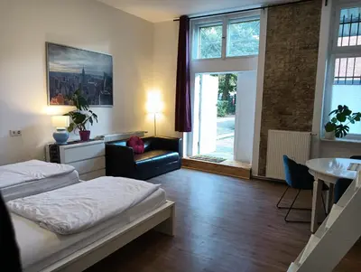 Ein Bett oder Betten in einem Zimmer der Unterkunft AF Apartments Studio Berlin
