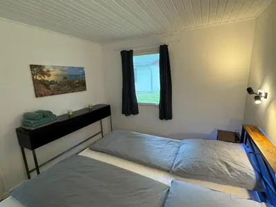 Ein Bett oder Betten in einem Zimmer der Unterkunft Feriendorf Seddiner See - Bungalow 2