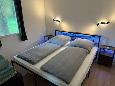 Ein Bett oder Betten in einem Zimmer der Unterkunft Feriendorf Seddiner See - Bungalow 2