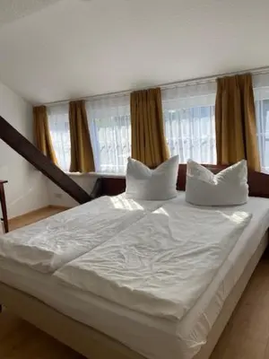 Ein Bett oder Betten in einem Zimmer der Unterkunft Landgasthaus Jahnsfelde