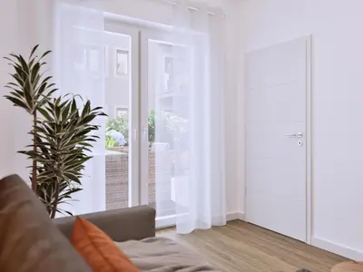Ein Sitzbereich in der Unterkunft Ferienwohnung Sonnenufer Residenz am See in Neuruppin