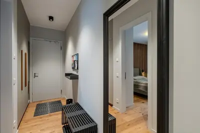 Ein Bett oder Betten in einem Zimmer der Unterkunft Marina Apartment am See mit Pool und Sauna